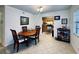 Bright dining room with wood table and chairs, kitchen partially visible at 6100 Gulfport S Blvd # 214, Gulfport, FL 33707