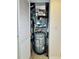 Concise description of mechanical room with water heater and HVAC at 6100 Gulfport S Blvd # 214, Gulfport, FL 33707