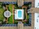 Overhead view of community pool and surrounding landscaping at 6100 Gulfport S Blvd # 214, Gulfport, FL 33707