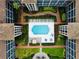 Directly above, a refreshing pool in a lush courtyard setting at 6100 Gulfport S Blvd # 214, Gulfport, FL 33707