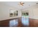 Bedroom with hardwood floors, pool view, and sliding doors at 6355 W Maclaurin Dr, Tampa, FL 33647