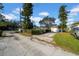 Long driveway leading to house with fenced yard at 646 38Th N Ave, St Petersburg, FL 33704