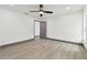 Spacious bedroom with ceiling fan and gray flooring at 6701 E 19Th Ave, Tampa, FL 33619