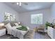 Second bedroom featuring a queen-size bed, dresser, and chair at 6781 121St Ave # F, Largo, FL 33773