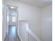 Upper level hallway with doors to bedrooms and bath at 6781 121St Ave # F, Largo, FL 33773