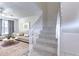 Interior view showing carpeted staircase leading to upper level at 6781 121St Ave # F, Largo, FL 33773