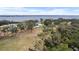 Aerial view showing a home with a large backyard and waterfront access at 724 Bayshore Dr, Terra Ceia, FL 34250