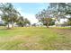 Aerial view of a waterfront home on a spacious lot with lush landscaping at 724 Bayshore Dr, Terra Ceia, FL 34250