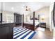 Main bedroom with a large bed, wood flooring and plenty of storage at 724 Bayshore Dr, Terra Ceia, FL 34250