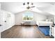 Bedroom with a queen-size bed and large window at 724 Bayshore Dr, Terra Ceia, FL 34250