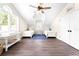 Well-lit bedroom with twin beds and built-in storage at 724 Bayshore Dr, Terra Ceia, FL 34250
