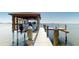 Covered boat lift on a spacious waterfront dock at 724 Bayshore Dr, Terra Ceia, FL 34250