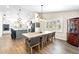 Bright dining room with hardwood floors and a view into the kitchen at 724 Bayshore Dr, Terra Ceia, FL 34250