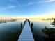White dock stretching to gazebo over calm water at 724 Bayshore Dr, Terra Ceia, FL 34250