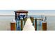 Boat lift and dock with spacious deck at 724 Bayshore Dr, Terra Ceia, FL 34250