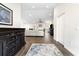 Bright and airy entryway with hardwood floors and views into the living room at 724 Bayshore Dr, Terra Ceia, FL 34250