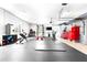 Home gym with various equipment and rubber flooring at 724 Bayshore Dr, Terra Ceia, FL 34250