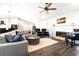 Living room with hardwood floors, fireplace, and comfortable seating area at 724 Bayshore Dr, Terra Ceia, FL 34250