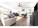 Spacious living room with hardwood floors, fireplace, and access to backyard at 724 Bayshore Dr, Terra Ceia, FL 34250