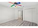 Neutral bedroom with a closet, light walls, and laminate flooring at 8701 Ballantrae Way, Tampa, FL 33647