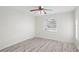 Bright bedroom with gray laminate flooring and a ceiling fan at 8701 Ballantrae Way, Tampa, FL 33647