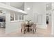 Sunlit breakfast nook with round table, seating for four, and bright white interior at 8701 Ballantrae Way, Tampa, FL 33647