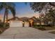 Beautiful home with a well-manicured lawn, mature trees and a three car garage at 8701 Ballantrae Way, Tampa, FL 33647