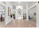 Open-concept foyer with tiled floor, high ceilings, and views of the pool and adjacent living spaces at 8701 Ballantrae Way, Tampa, FL 33647