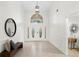 Bright foyer features high ceilings, neutral walls, tiled floor, and stylish décor at 8701 Ballantrae Way, Tampa, FL 33647