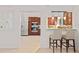 Bright kitchen view with stainless steel refrigerator and modern dark wood cabinets at 8701 Ballantrae Way, Tampa, FL 33647