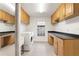 Well-lit laundry room with washer, dryer, and plenty of cabinet space at 8701 Ballantrae Way, Tampa, FL 33647