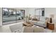 Cozy and inviting living room boasts natural light, modern decor, and comfortable seating at 8701 Ballantrae Way, Tampa, FL 33647