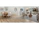 Cozy open living space featuring wood floors, a dining area, and comfortable seating at 8701 Ballantrae Way, Tampa, FL 33647