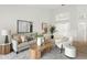 Bright living room featuring neutral furniture, wood floors and eye-catching abstract artwork at 8701 Ballantrae Way, Tampa, FL 33647
