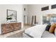 Airy primary bedroom with a statement art piece and sliding door to lanai at 8701 Ballantrae Way, Tampa, FL 33647