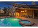 Outdoor living is easy with the pool, spa, outdoor kitchen, and grill area under a screened enclosure at 8701 Ballantrae Way, Tampa, FL 33647