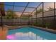A luxurious spa and pool with brick surround and privacy fence, ideal for relaxation at 8701 Ballantrae Way, Tampa, FL 33647