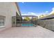 A beautiful screened pool with a brick patio is surrounded by lush landscaping, perfect for outdoor relaxation and entertainment at 8701 Ballantrae Way, Tampa, FL 33647