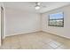 Bedroom with tiled floors and large window at 9825 Harrell Ave # 202, Treasure Island, FL 33706