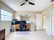 Bright bedroom with home office setup and ceiling fan at 13956 75Th Ave, Seminole, FL 33776