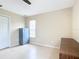 Bedroom with wood floors, window, and desk at 13956 75Th Ave, Seminole, FL 33776