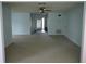 Open living room showcasing light blue walls and carpeted floors at 1405 Langley Dr # 97, Sun City Center, FL 33573