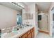 Main bathroom with double vanity and shower/tub at 15521 Long Cypress Dr, Ruskin, FL 33573