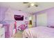 bedroom with pink accents and a play area at 15521 Long Cypress Dr, Ruskin, FL 33573