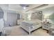 Main bedroom with king-size bed and ceiling fan at 15521 Long Cypress Dr, Ruskin, FL 33573