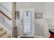 Interior entryway with stairs and photo display at 15521 Long Cypress Dr, Ruskin, FL 33573