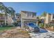 Two story house with driveway and landscaping at 15521 Long Cypress Dr, Ruskin, FL 33573
