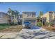 Two-story house with attached garage and palm trees at 15521 Long Cypress Dr, Ruskin, FL 33573
