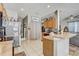 Kitchen with stainless steel appliances and wood cabinets at 15521 Long Cypress Dr, Ruskin, FL 33573