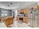 Spacious kitchen with stainless steel appliances and wood cabinets at 15521 Long Cypress Dr, Ruskin, FL 33573